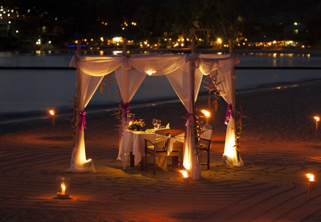 An intimate candlelit private dinner by the water